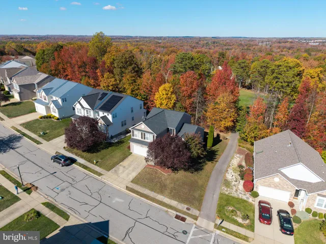 an aerial view of residential house with swimming pool
