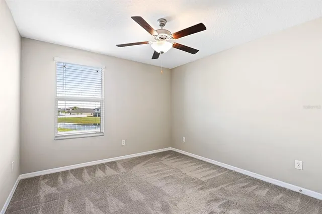 a view of a swimming pool with an outdoor seating