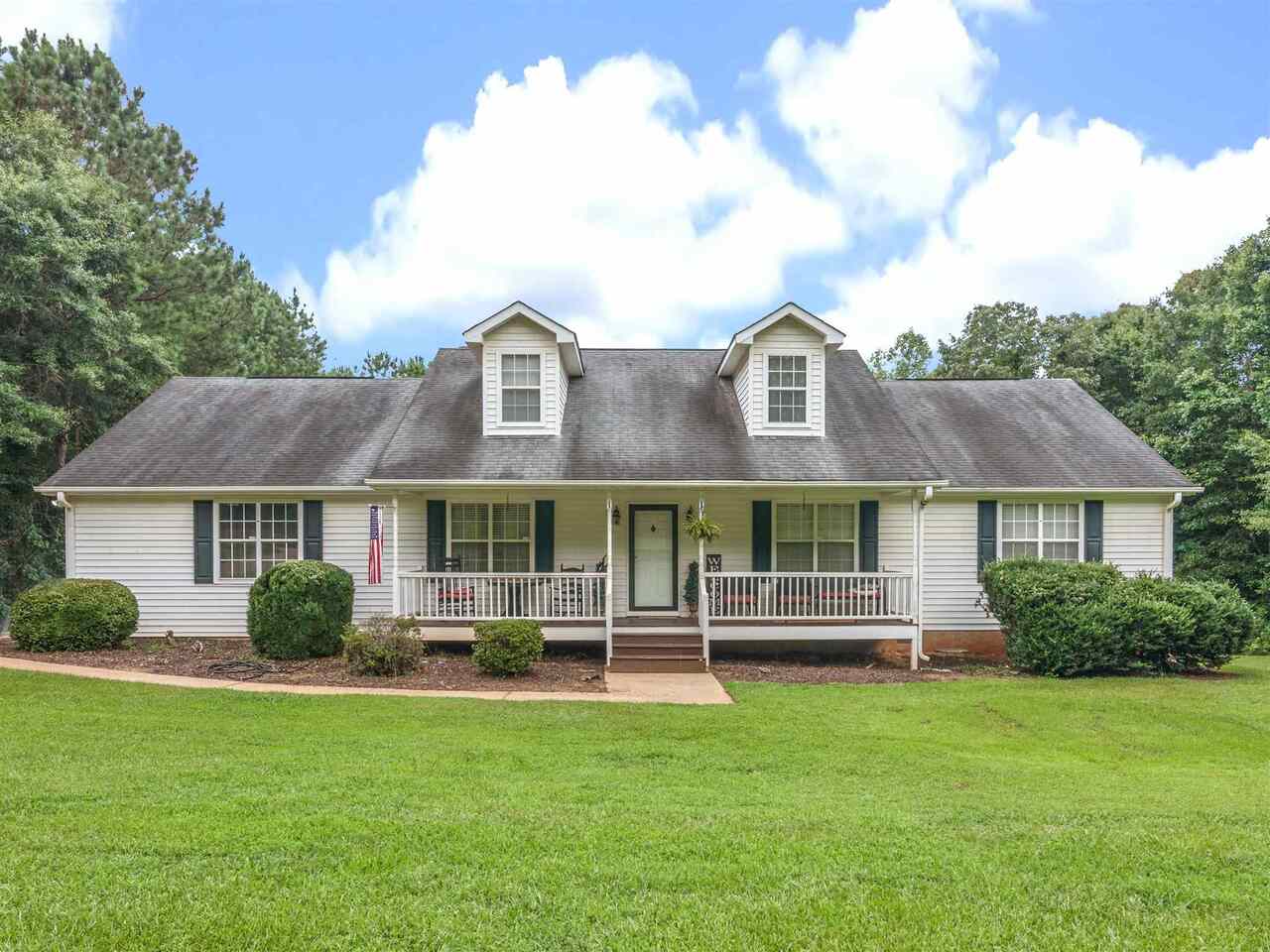 549 Higgins Road Locust Grove, GA 30248 - Photo 1 of 1 a front view of a house with a garden
