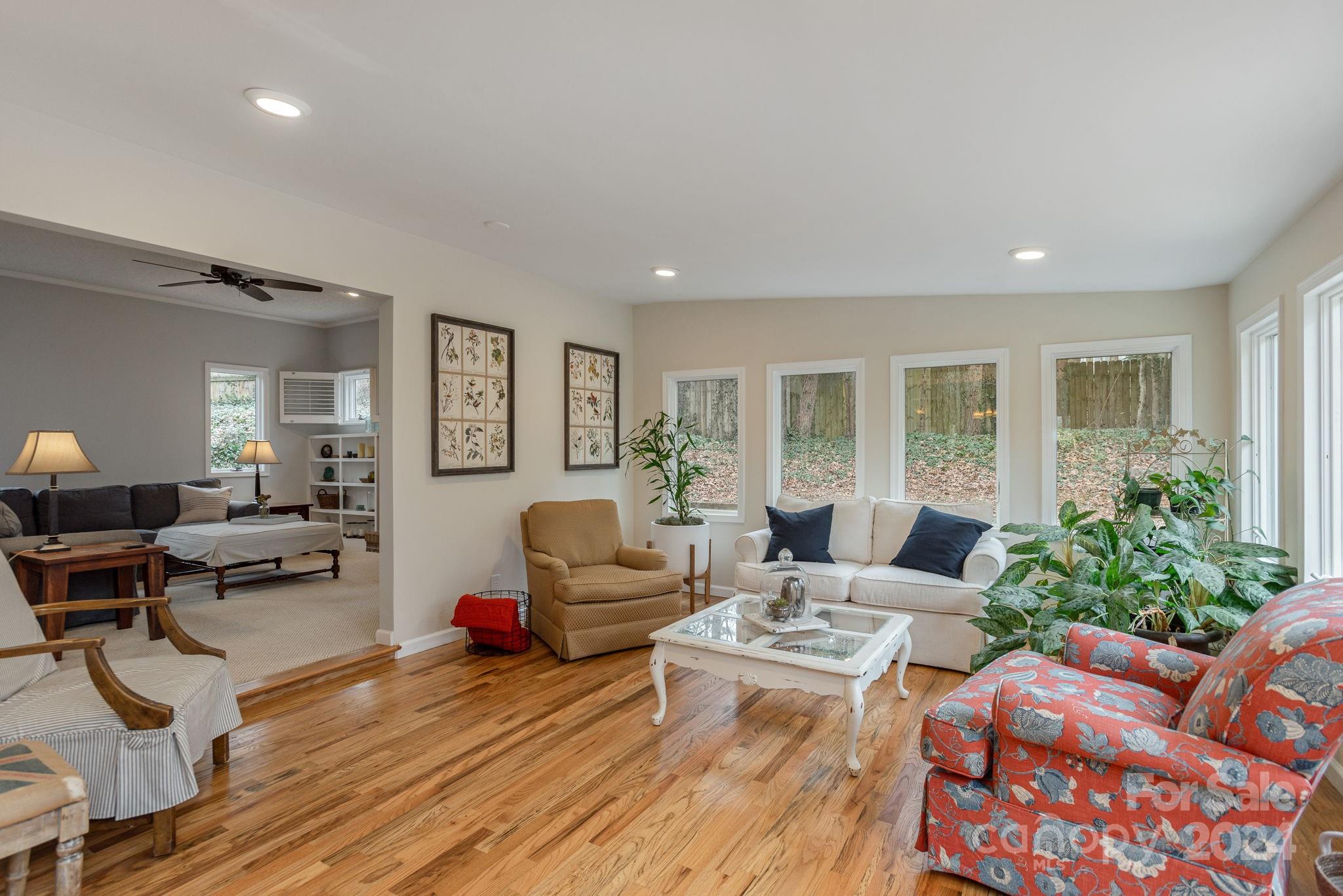 21 Spring Cove Court Arden, NC 28704 - Photo 14 of 32 a living room with furniture and a wooden floor