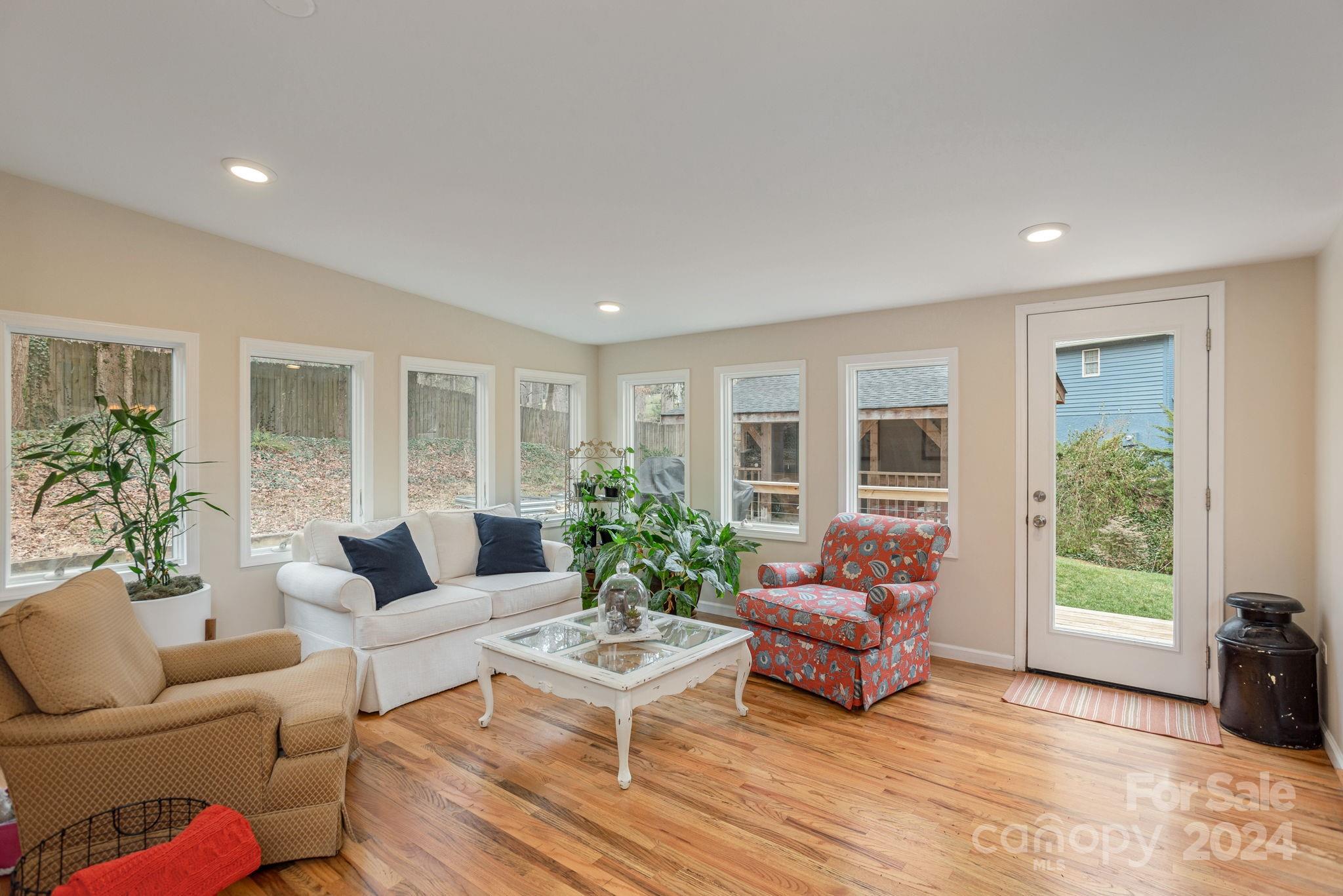 21 Spring Cove Court Arden, NC 28704 - Photo 15 of 32 a living room with furniture and a large window