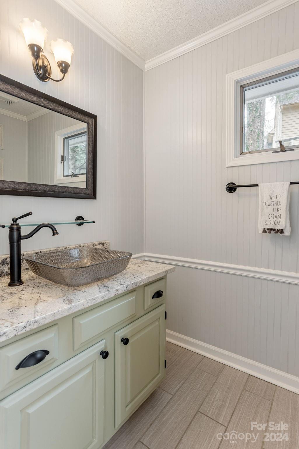 21 Spring Cove Court Arden, NC 28704 - Photo 16 of 32 a bathroom with a granite countertop sink and a mirror