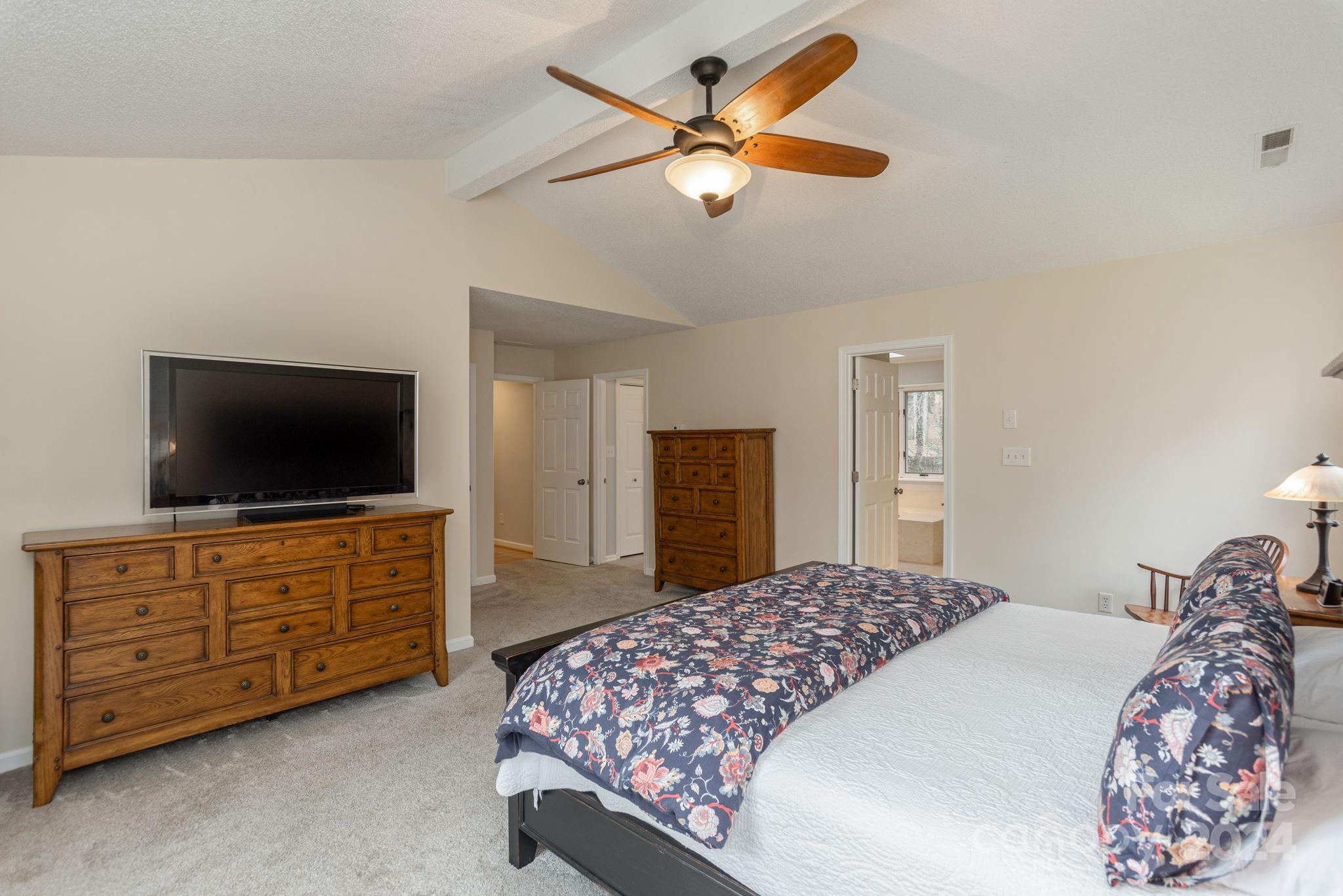 21 Spring Cove Court Arden, NC 28704 - Photo 18 of 32 a bedroom with a bed and a flat screen tv