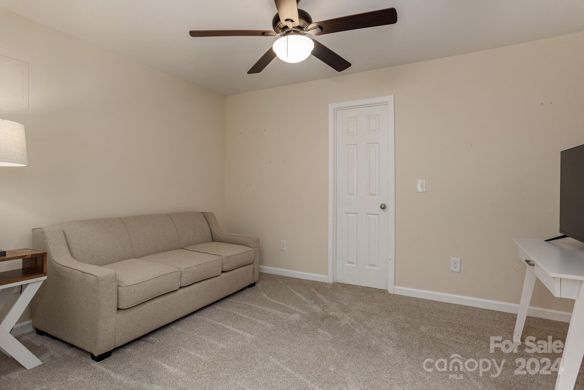 21 Spring Cove Court Arden, NC 28704 - Photo 28 of 32 a living room with furniture and a ceiling fan