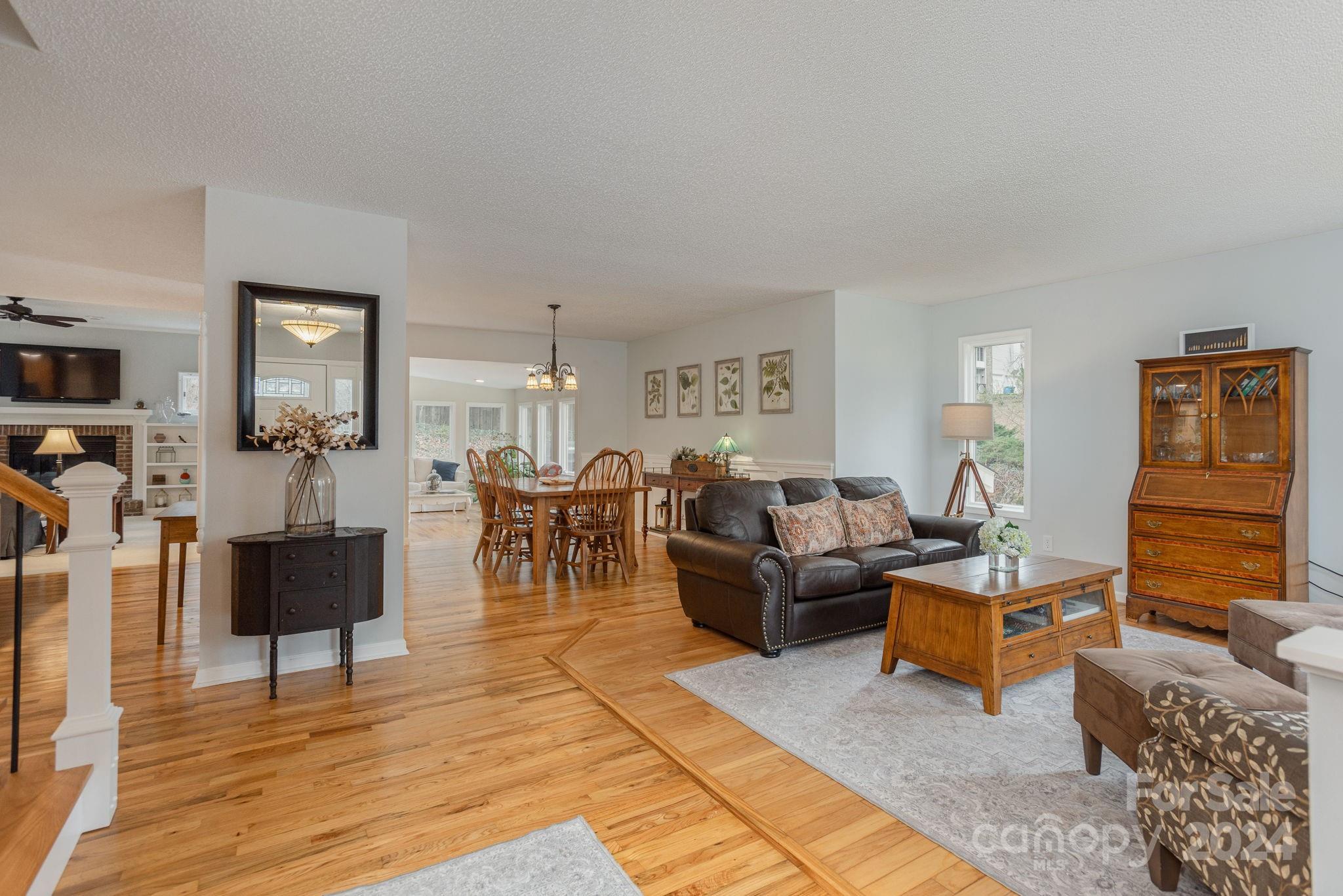 21 Spring Cove Court Arden, NC 28704 - Photo 3 of 32 a living room with fireplace furniture and a rug