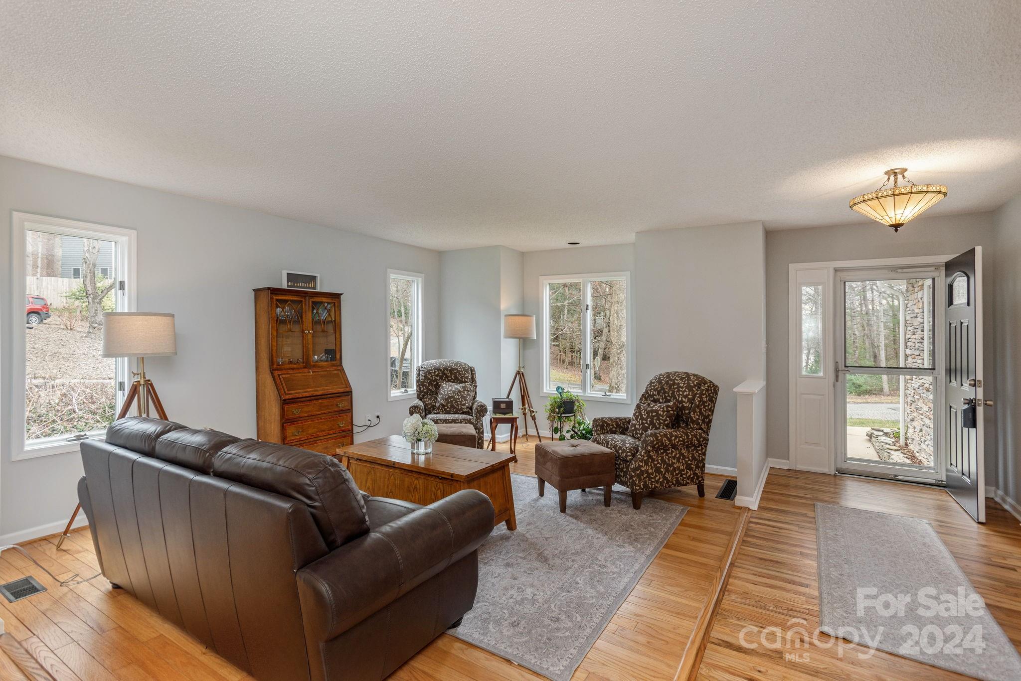 21 Spring Cove Court Arden, NC 28704 - Photo 4 of 32 a living room with furniture and a window
