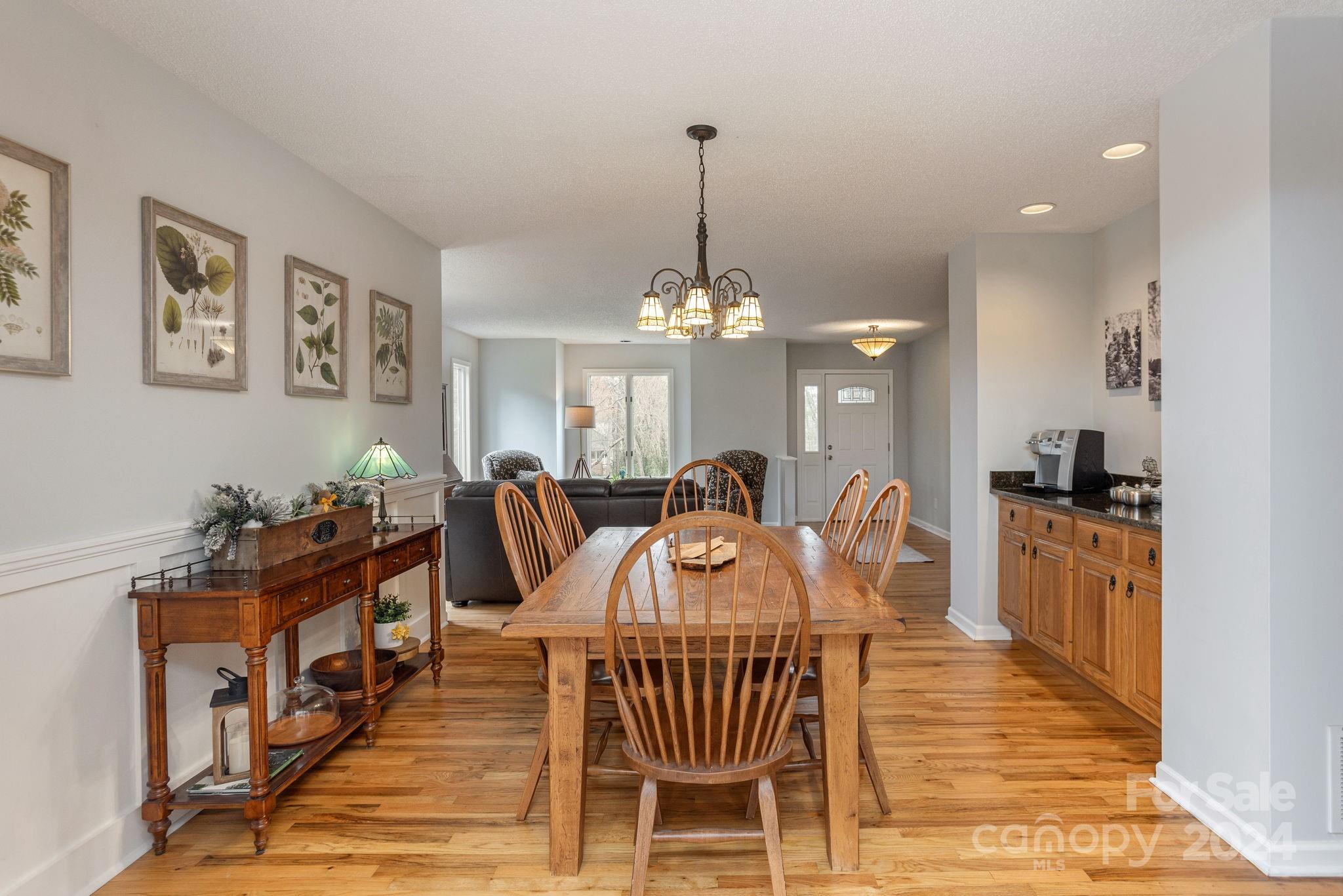 21 Spring Cove Court Arden, NC 28704 - Photo 6 of 32 a view of a dining room with furniture and a chandelier