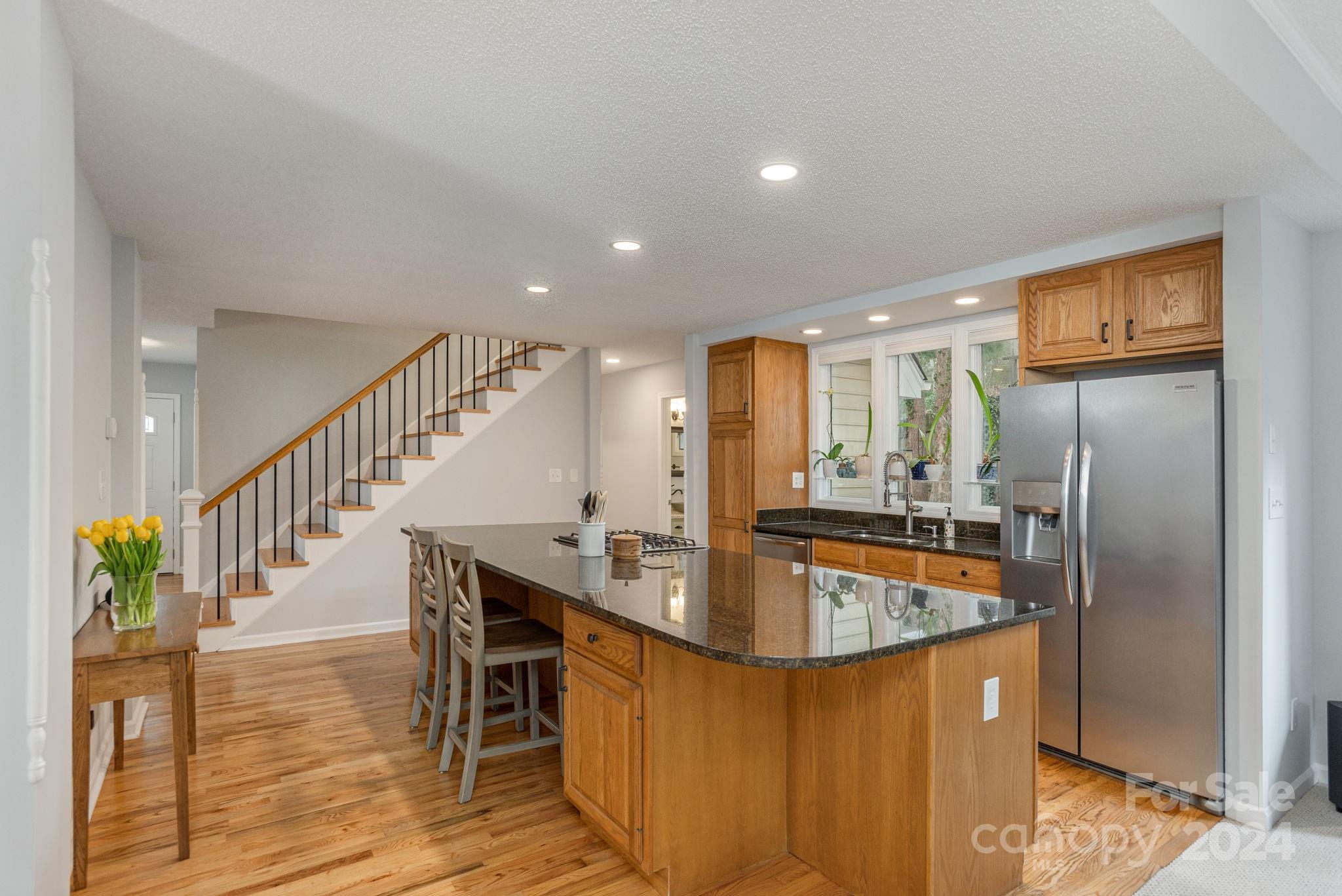 21 Spring Cove Court Arden, NC 28704 - Photo 8 of 32 a kitchen with stainless steel appliances granite countertop a refrigerator a sink and a stove