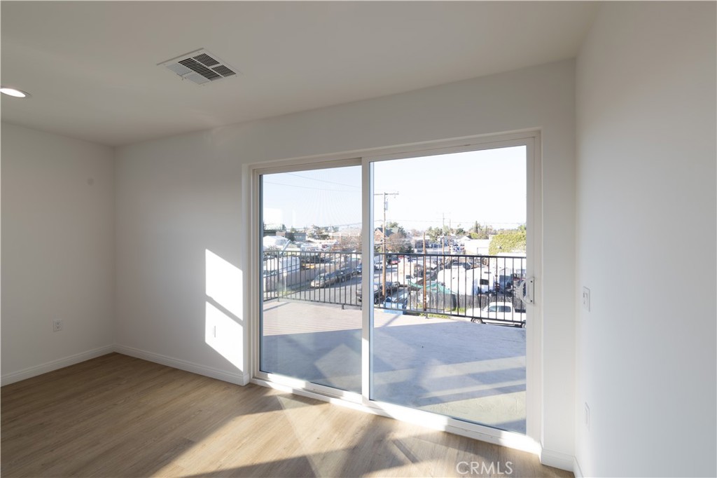 211 Hathaway Street, Unit B Santa Ana, CA 92701 - Photo 5 of 14 Sliding glass door leading to large balcony