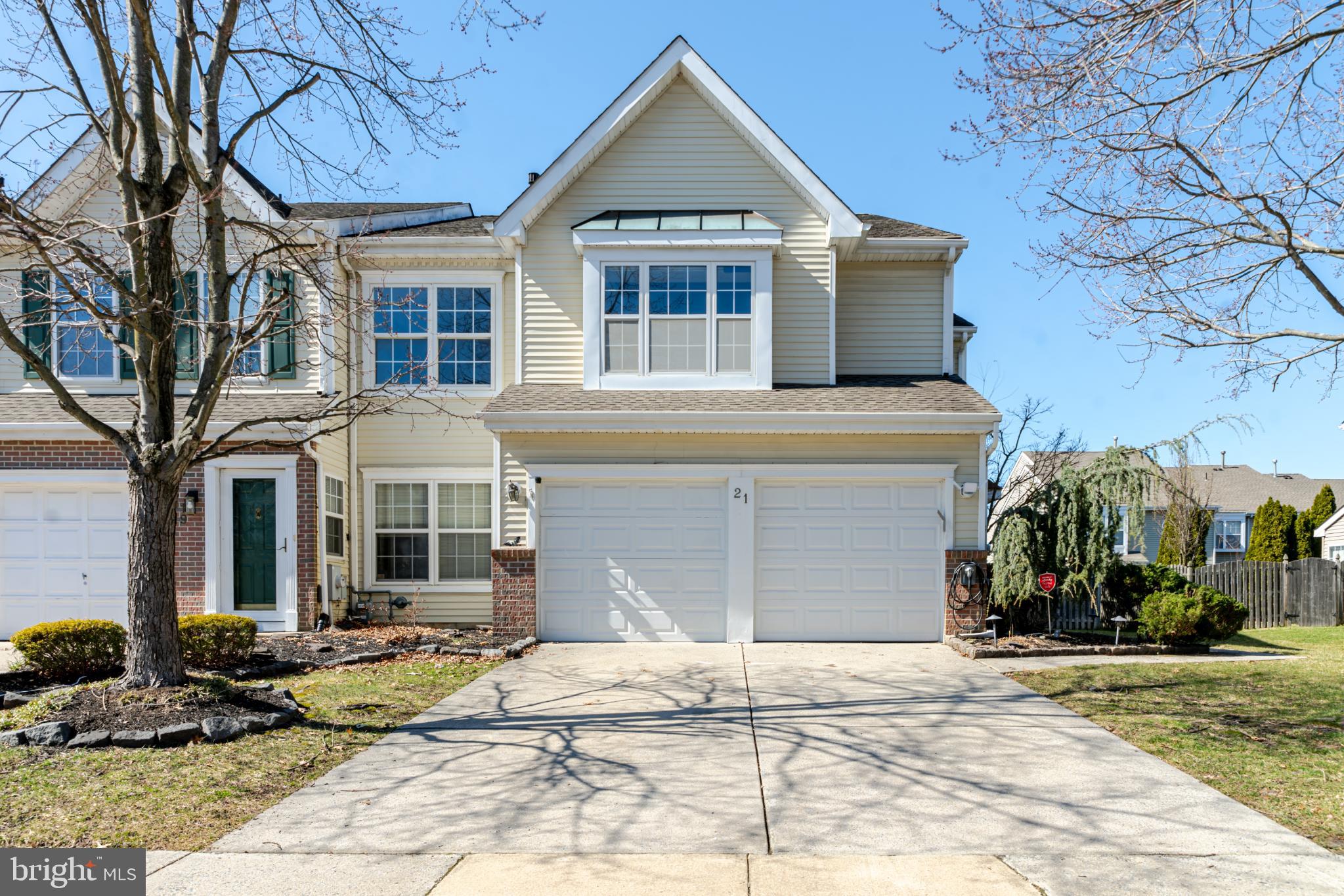 21 Stokes Road Mount Laurel, NJ 08054 - Photo 1 of 36 a front view of a house with a yard and garage