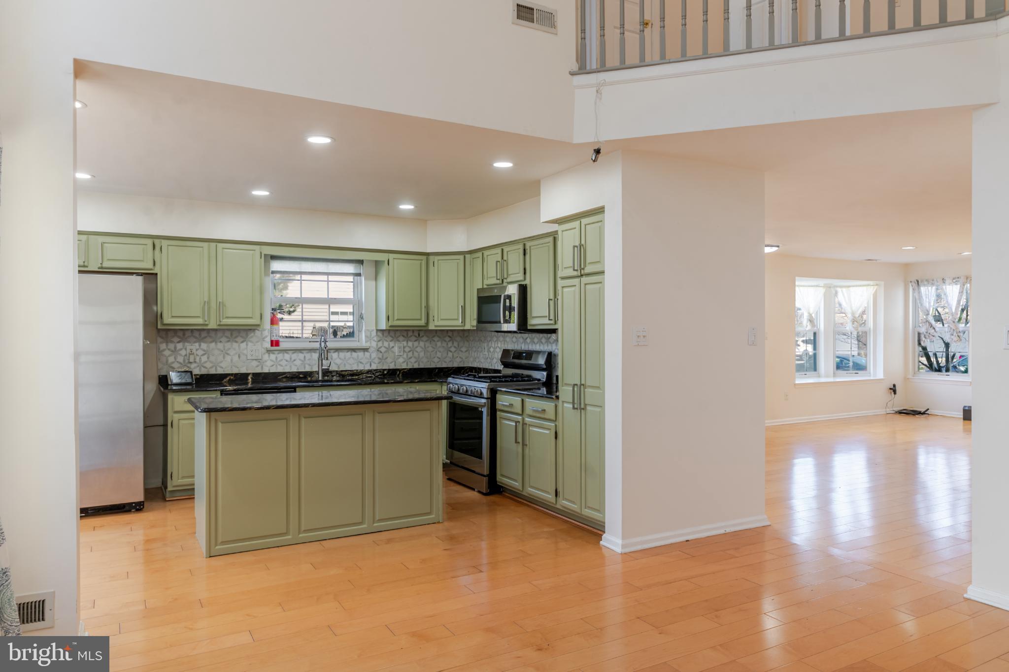 21 Stokes Road Mount Laurel, NJ 08054 - Photo 15 of 36 a kitchen with stainless steel appliances granite countertop a refrigerator and a stove