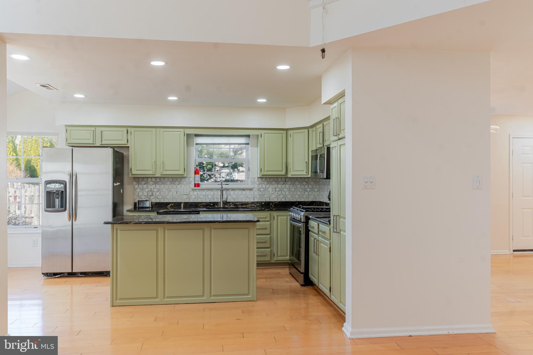 21 Stokes Road Mount Laurel, NJ 08054 - Photo 16 of 36 a kitchen with stainless steel appliances granite countertop a refrigerator a stove and a sink