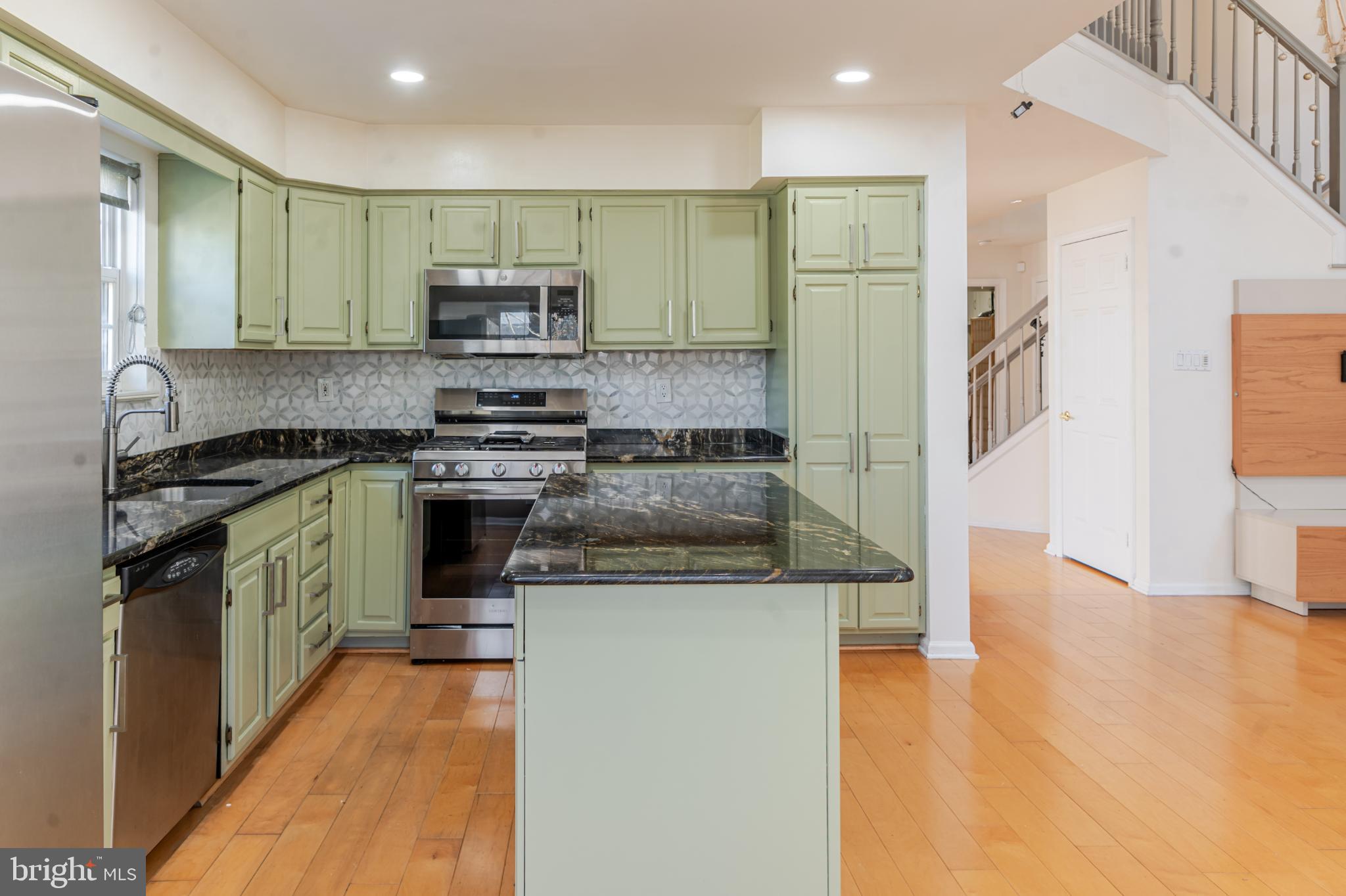 21 Stokes Road Mount Laurel, NJ 08054 - Photo 19 of 36 a kitchen with stainless steel appliances granite countertop a stove and a refrigerator