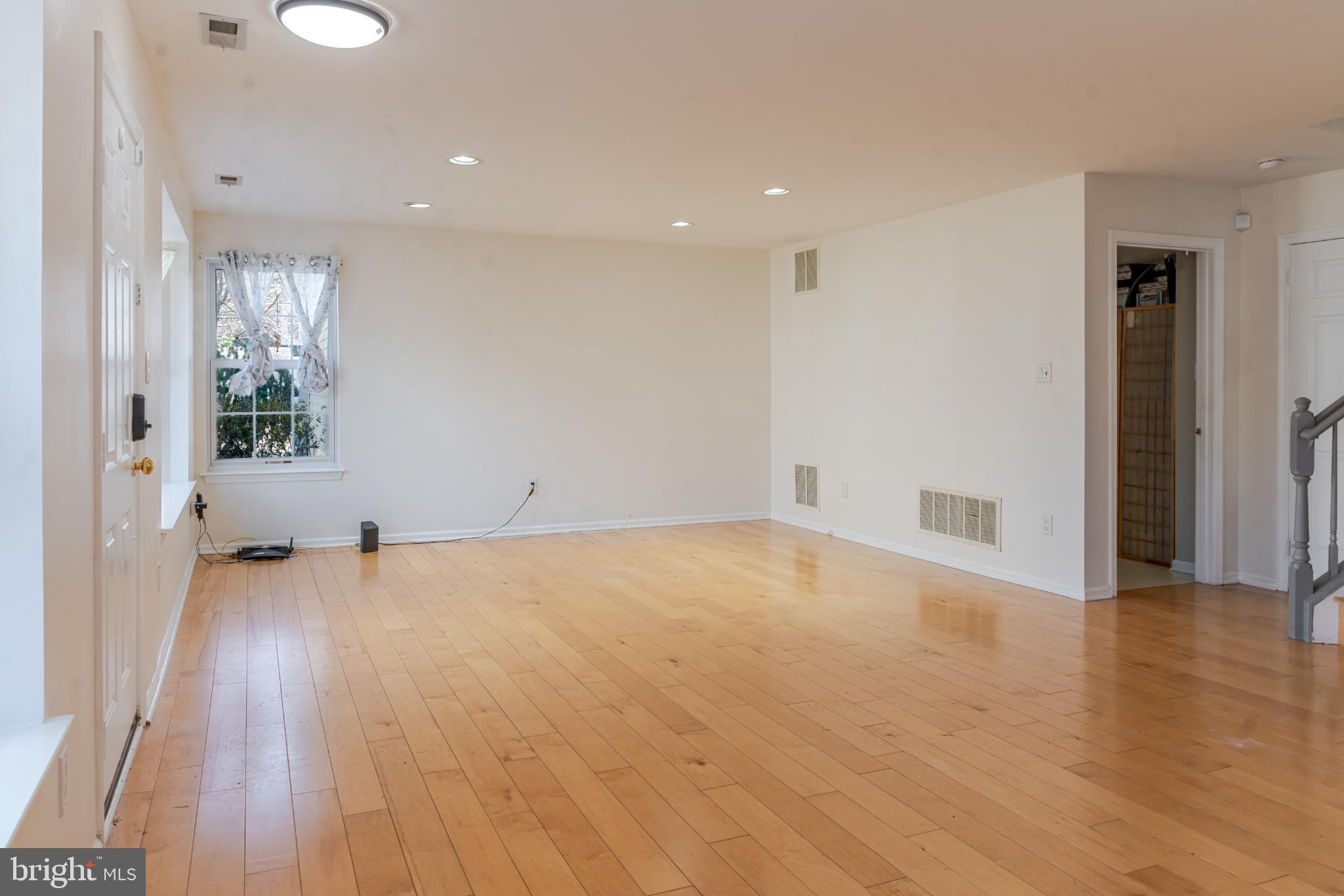 21 Stokes Road Mount Laurel, NJ 08054 - Photo 4 of 36 an empty room with wooden floor and windows