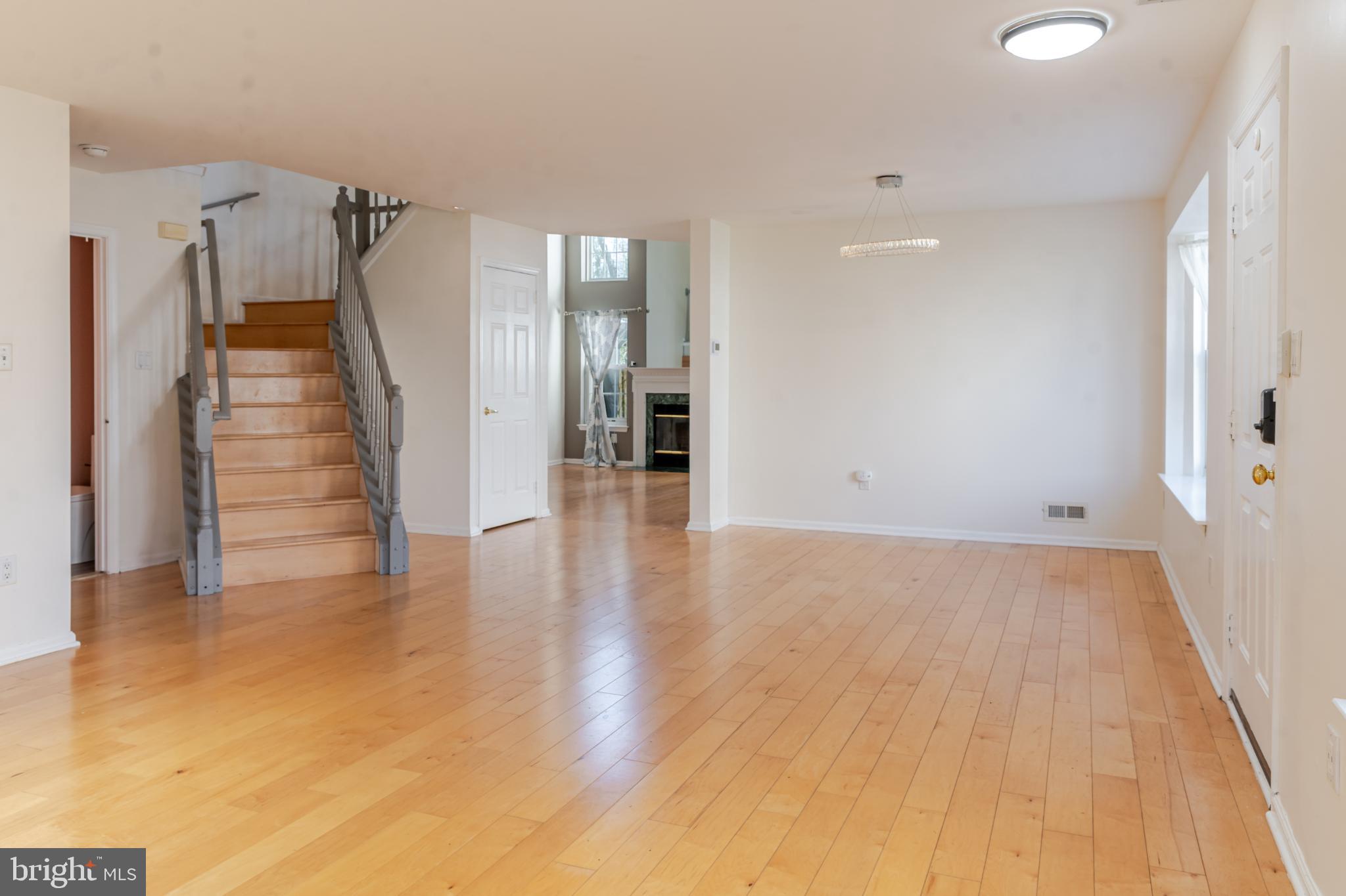 21 Stokes Road Mount Laurel, NJ 08054 - Photo 7 of 36 a view of a livingroom with wooden floor and stairs