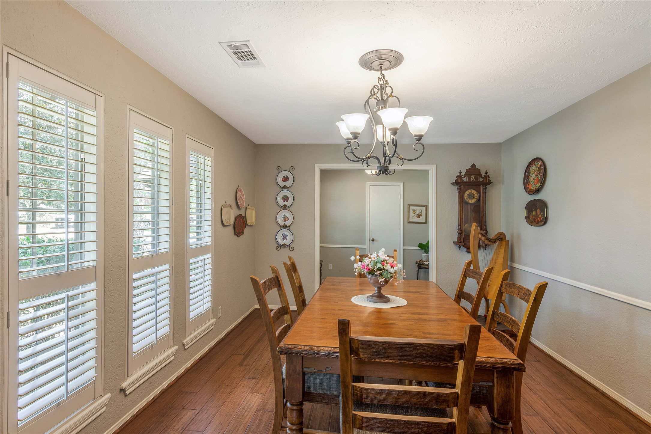 6411 Northway Drive Spring, TX 77389 - Photo 12 of 39 a view of a dining room with furniture a chandelier and wooden floor