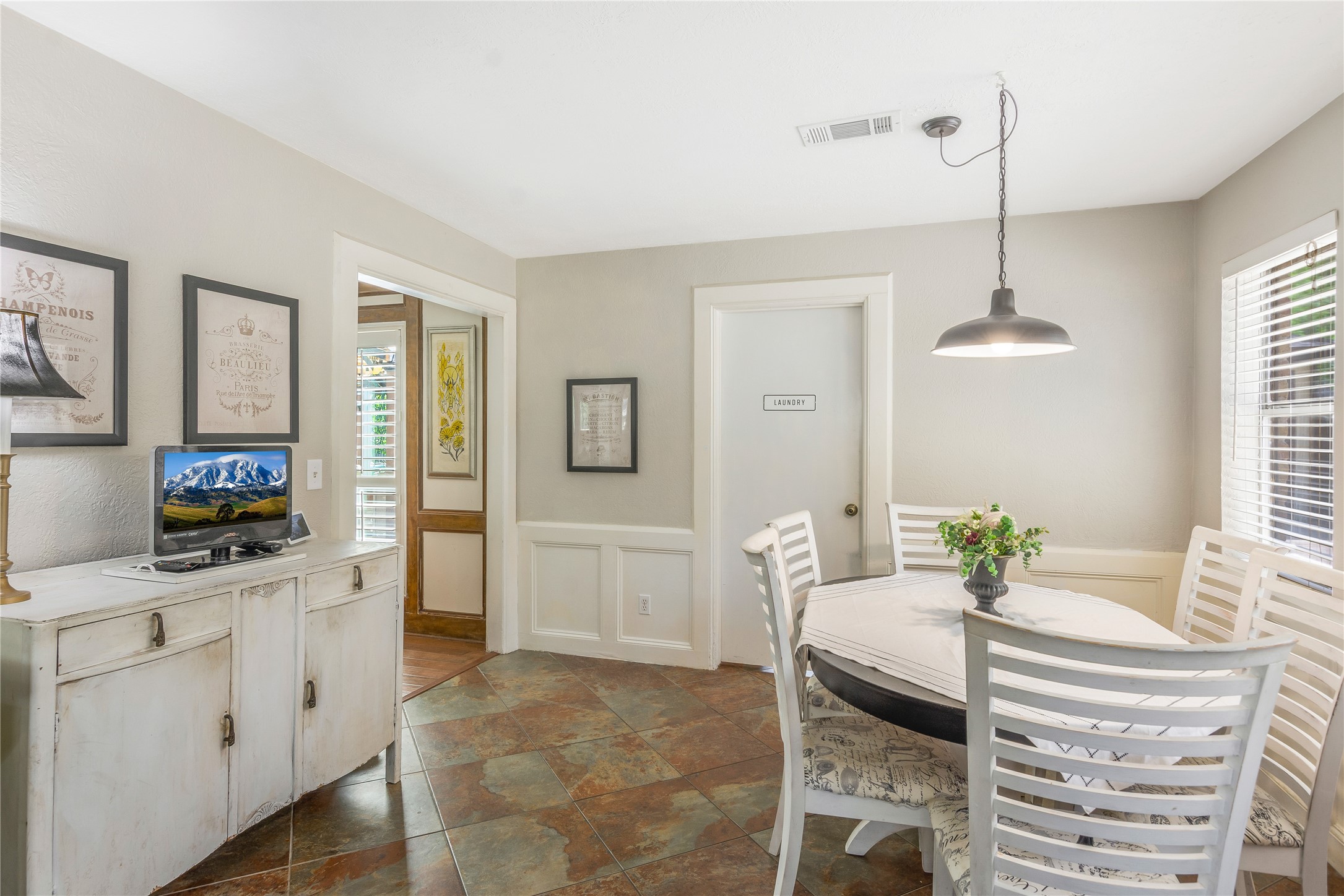6411 Northway Drive Spring, TX 77389 - Photo 15 of 39 a living room with furniture a flat screen tv and a chandelier