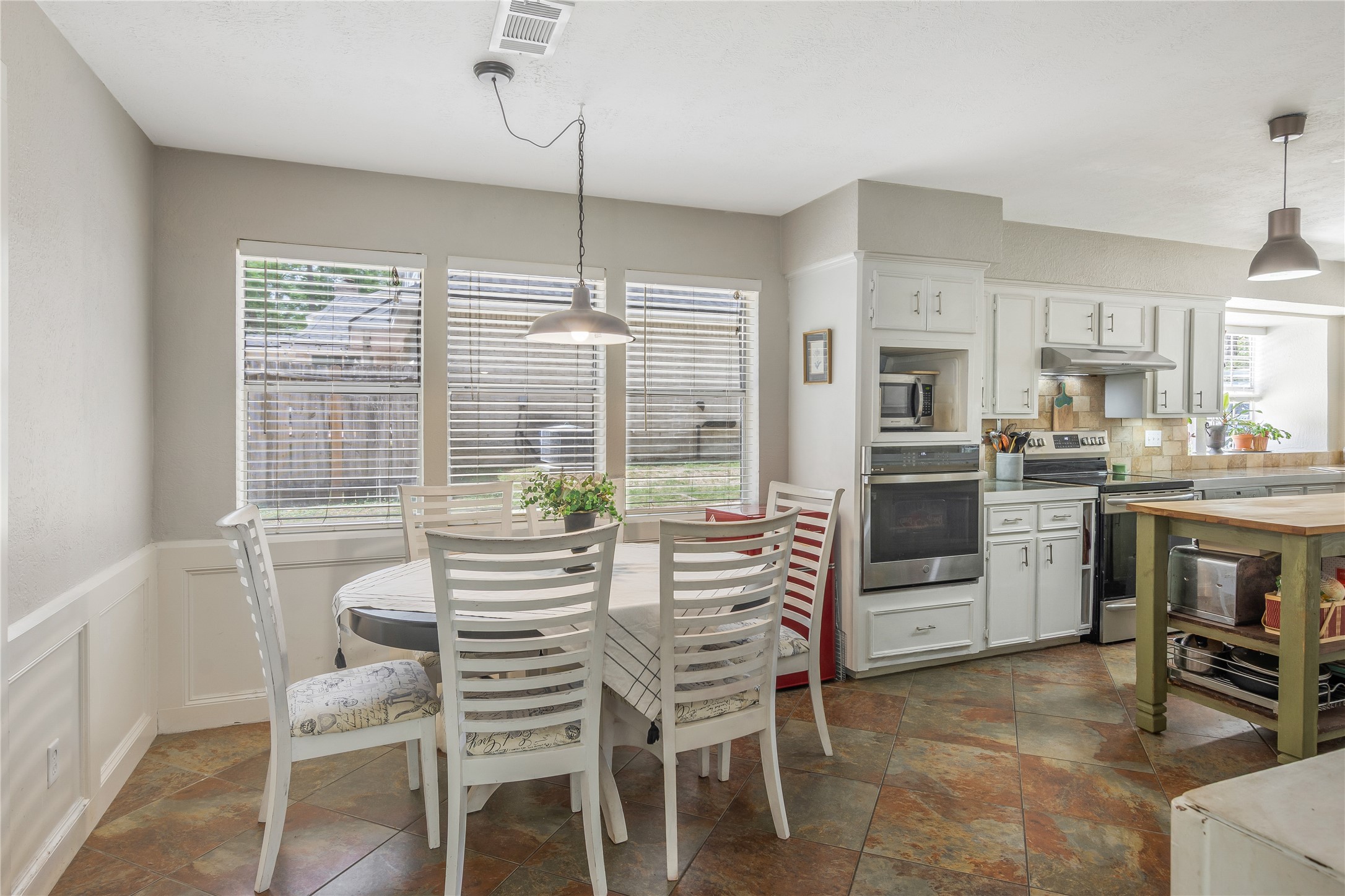 6411 Northway Drive Spring, TX 77389 - Photo 17 of 39 a dining room with furniture and large windows