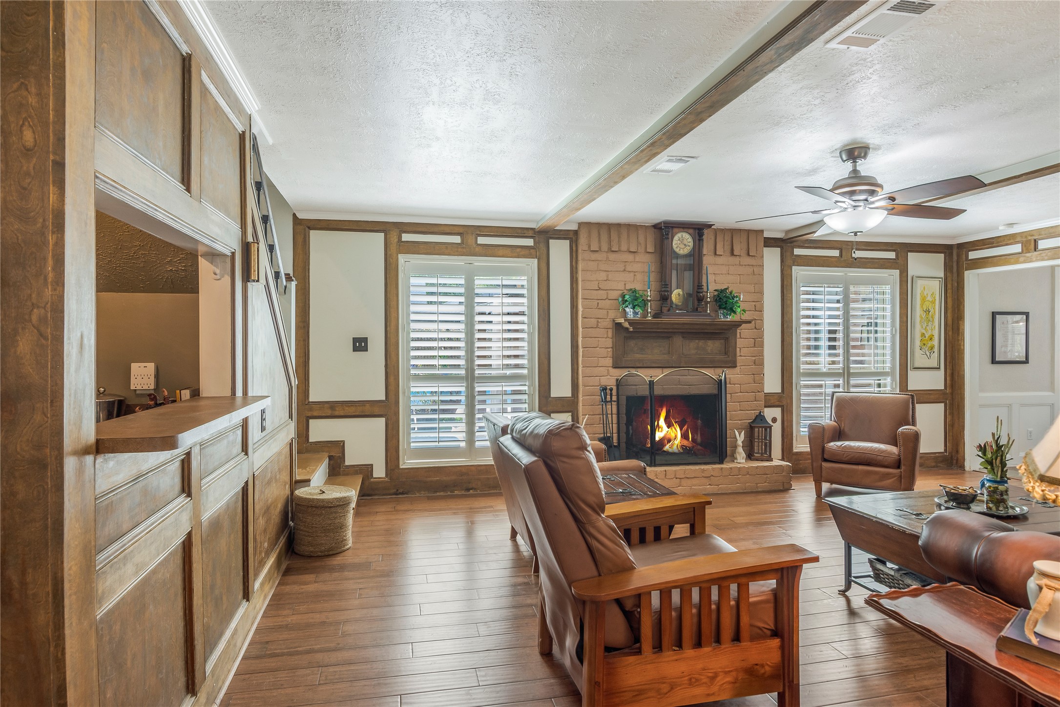 6411 Northway Drive Spring, TX 77389 - Photo 18 of 39 a living room with furniture a fireplace and a large window