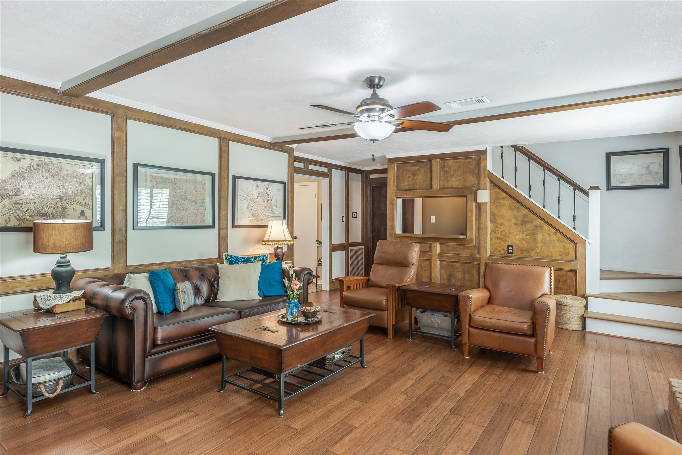 6411 Northway Drive Spring, TX 77389 - Photo 23 of 39 A standout highlight is the convenient wet bar area, seamlessly integrated into the space under the stairs. It serves as the perfect spot for serving drinks while hosting family and friends, adding both functionality and upscale charm to the room.