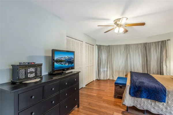 a bedroom with bed and a window
