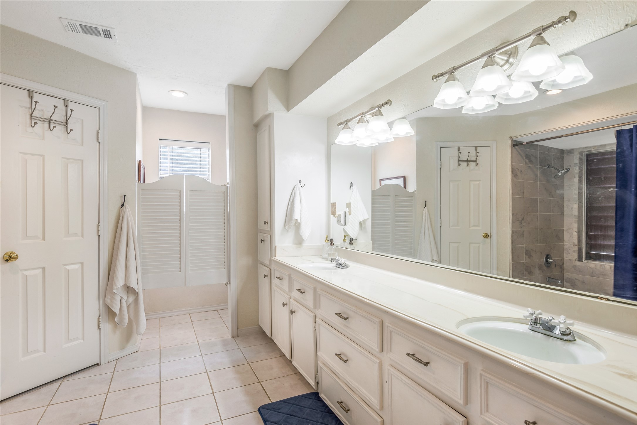 6411 Northway Drive Spring, TX 77389 - Photo 29 of 39 a spacious bathroom with a granite countertop sink a toilet a mirror and shower