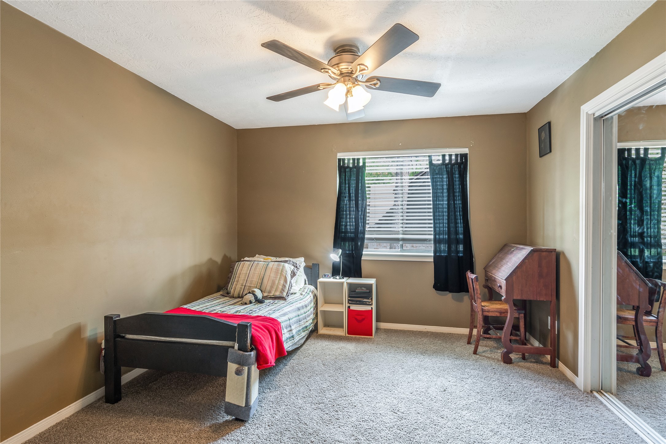6411 Northway Drive Spring, TX 77389 - Photo 34 of 39 a bedroom with a bed and a window