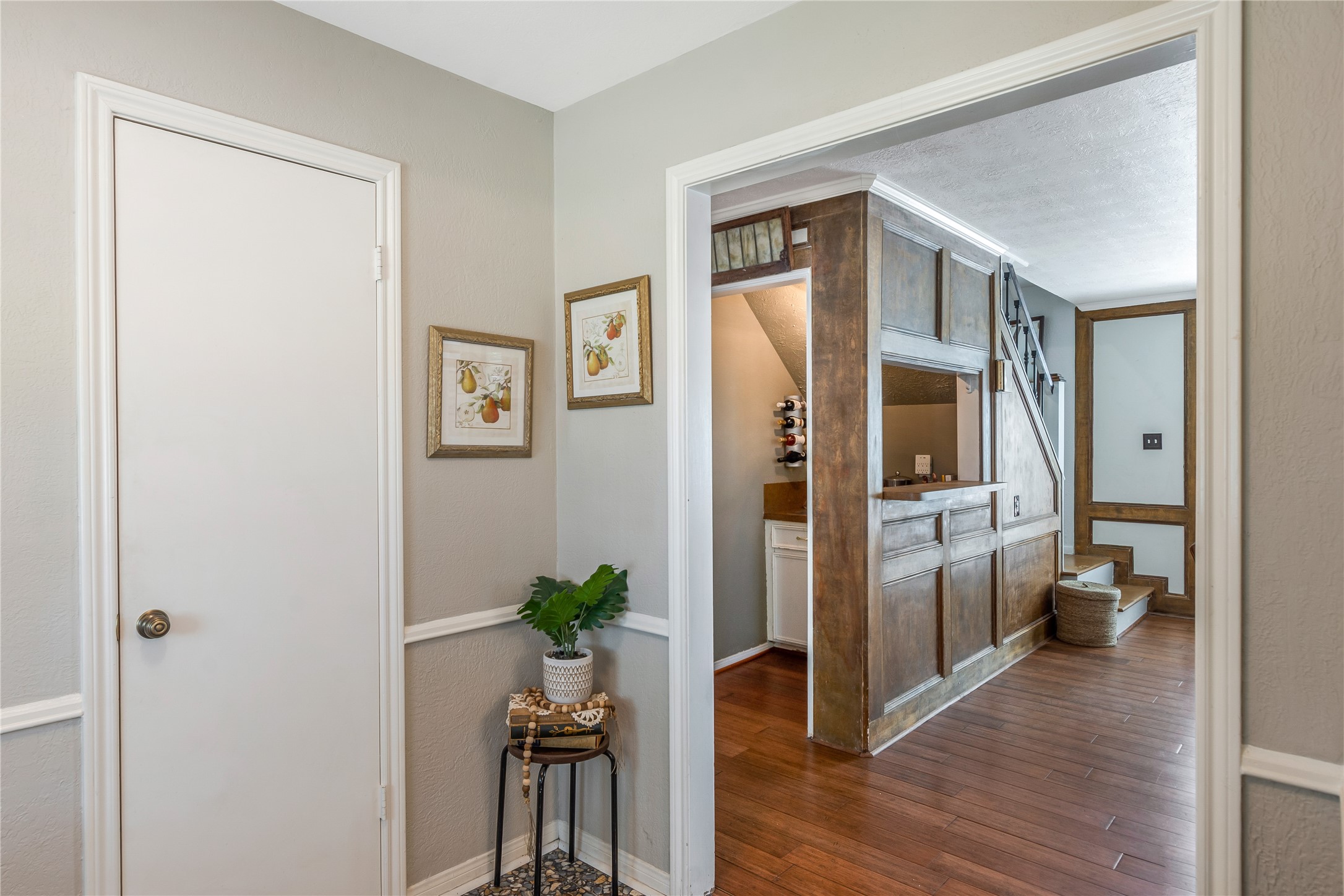 6411 Northway Drive Spring, TX 77389 - Photo 9 of 39 From the welcoming entryway, your eyes are immediately drawn to the convenient wet bar area, seamlessly integrated into the living space. This thoughtful layout creates a smooth, inviting flow from the moment you step inside.