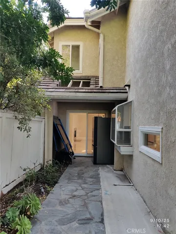 a front view of a house with a yard and seating area
