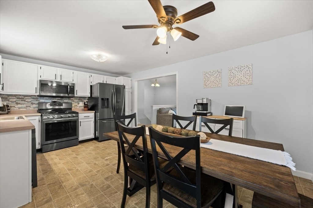 143 Morrison Road East Taunton, MA 02718 - Photo 12 of 31 a view of a dining room with furniture and a kitchen