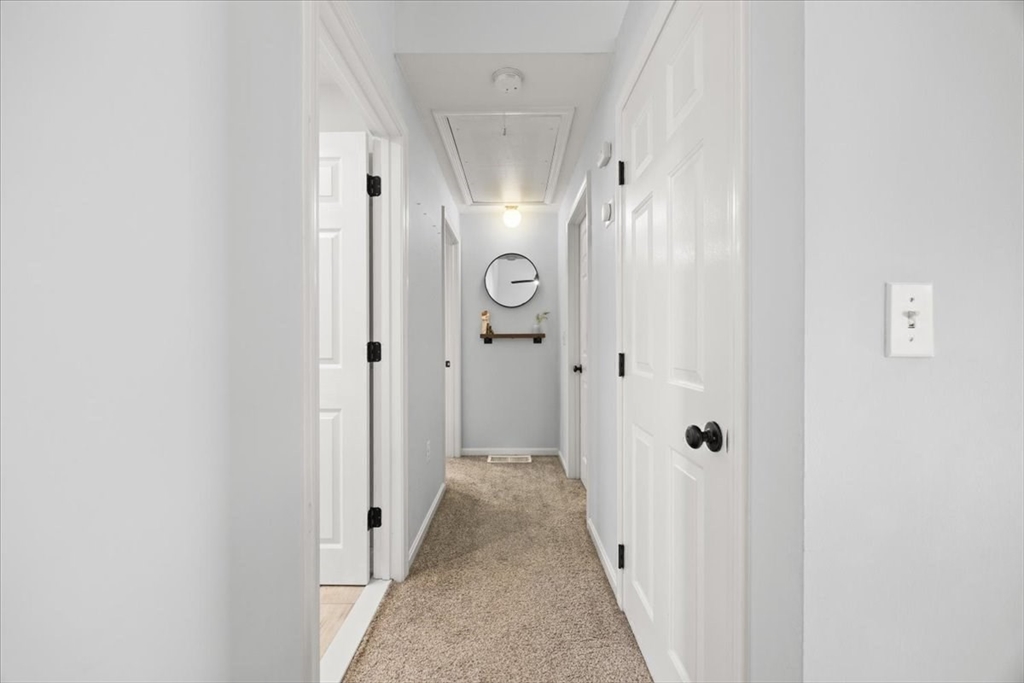 143 Morrison Road East Taunton, MA 02718 - Photo 13 of 31 a view of a hallway with wooden door