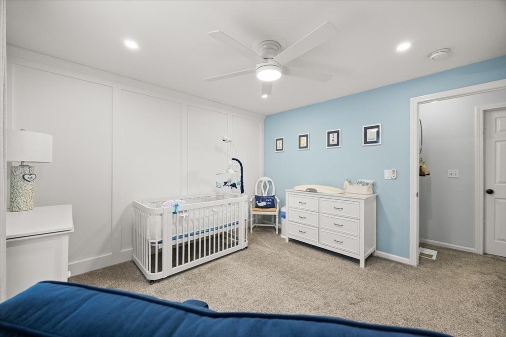 143 Morrison Road East Taunton, MA 02718 - Photo 20 of 31 a view of a bedroom with baby crib and furniture