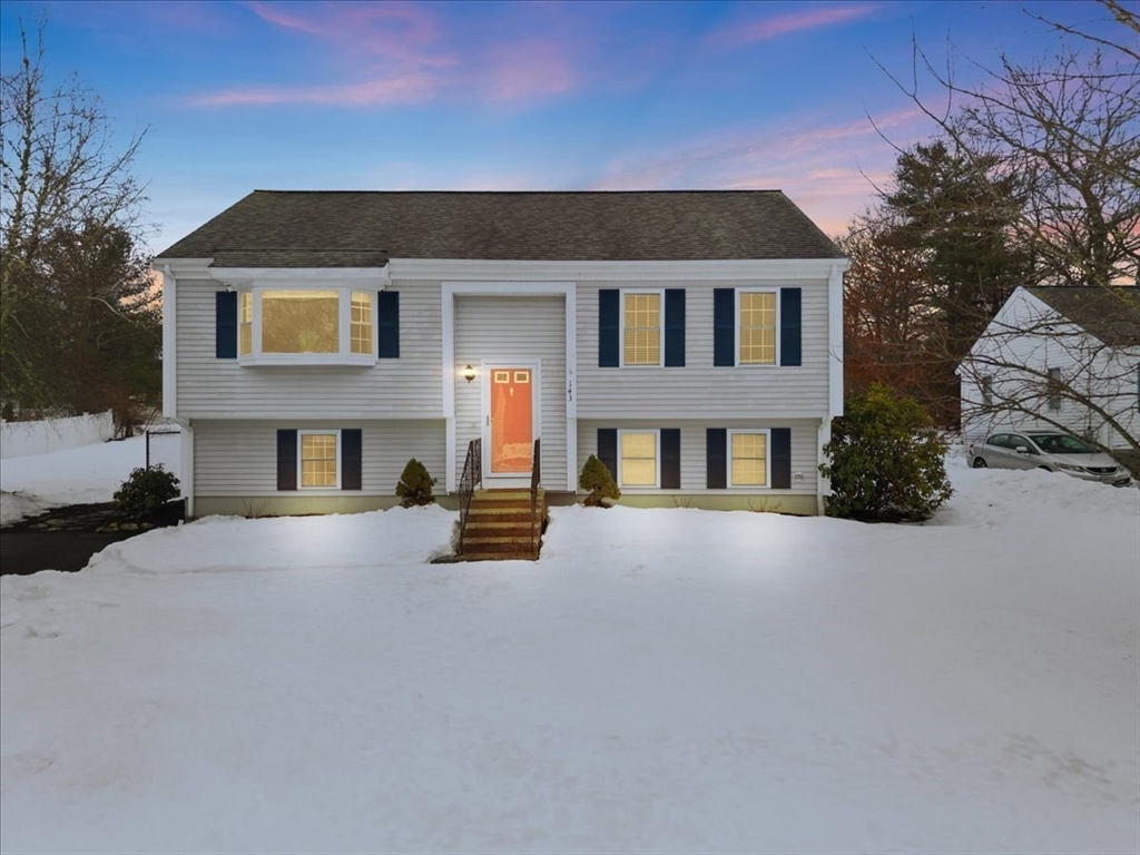 143 Morrison Road East Taunton, MA 02718 - Photo 2 of 31 a front view of a house with a yard and garage