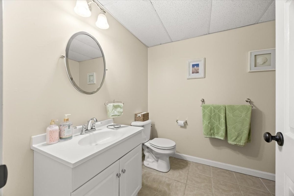 143 Morrison Road East Taunton, MA 02718 - Photo 25 of 31 a bathroom with a toilet sink and mirror