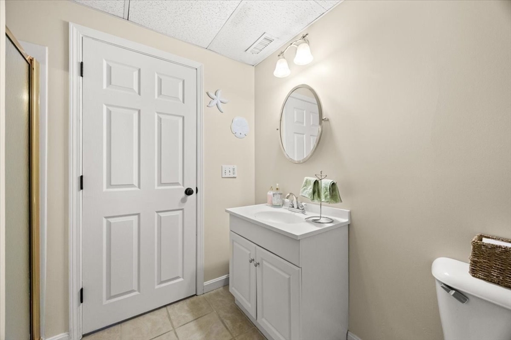 143 Morrison Road East Taunton, MA 02718 - Photo 26 of 31 a bathroom with a sink and a mirror