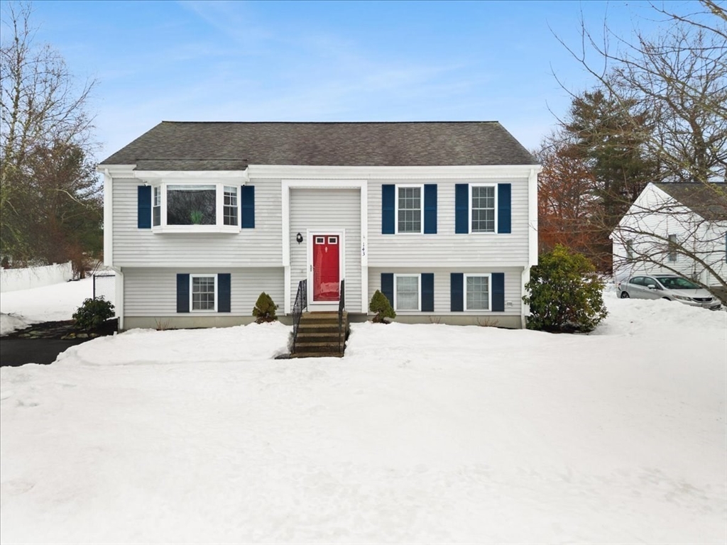 143 Morrison Road East Taunton, MA 02718 - Photo 3 of 31 a front view of a house with a yard and garage