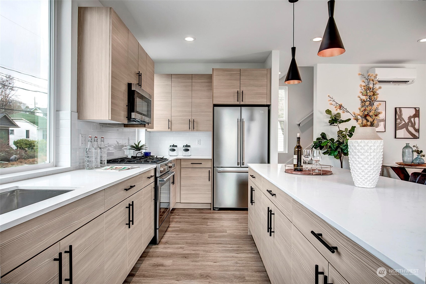 4020 Midvale Avenue North Seattle, WA 98103 - Photo 8 of 28 a kitchen with white cabinets and stainless steel appliances