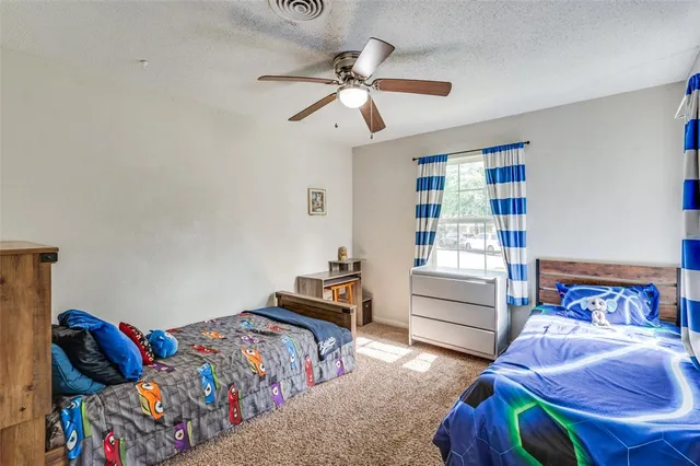 a bedroom with furniture and a window
