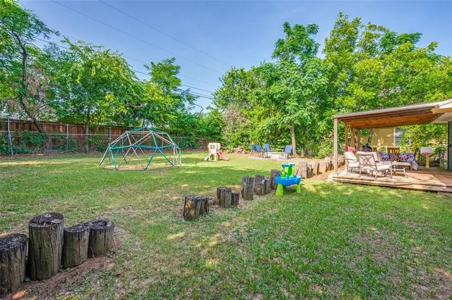a view of a park with swings and slides