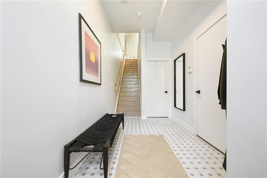 313 38th Street Pittsburgh, PA 15201 - Photo 2 of 25 a view of a hallway with wooden floor and staircase