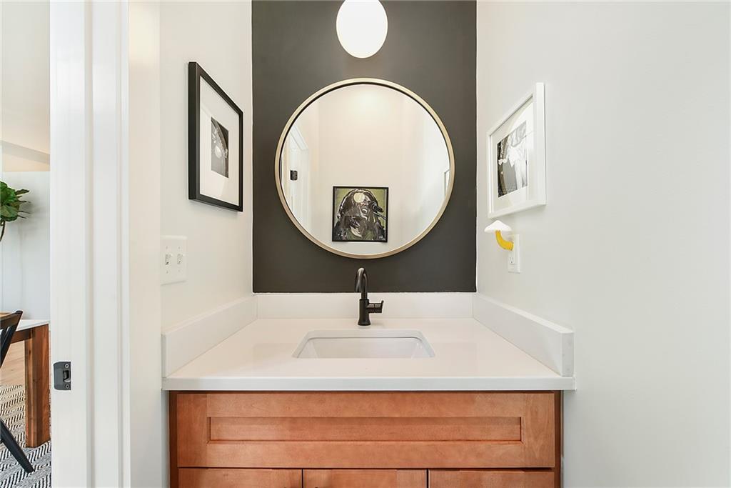313 38th Street Pittsburgh, PA 15201 - Photo 14 of 25 a bathroom with a sink and a mirror