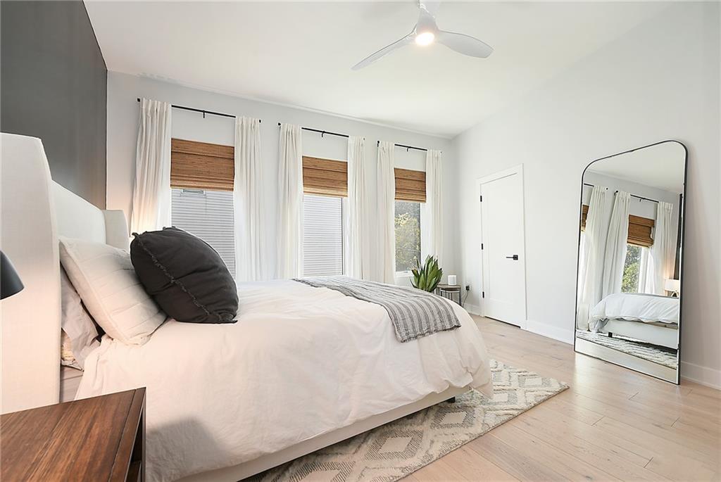 313 38th Street Pittsburgh, PA 15201 - Photo 15 of 25 a bedroom with a bed and a large mirror