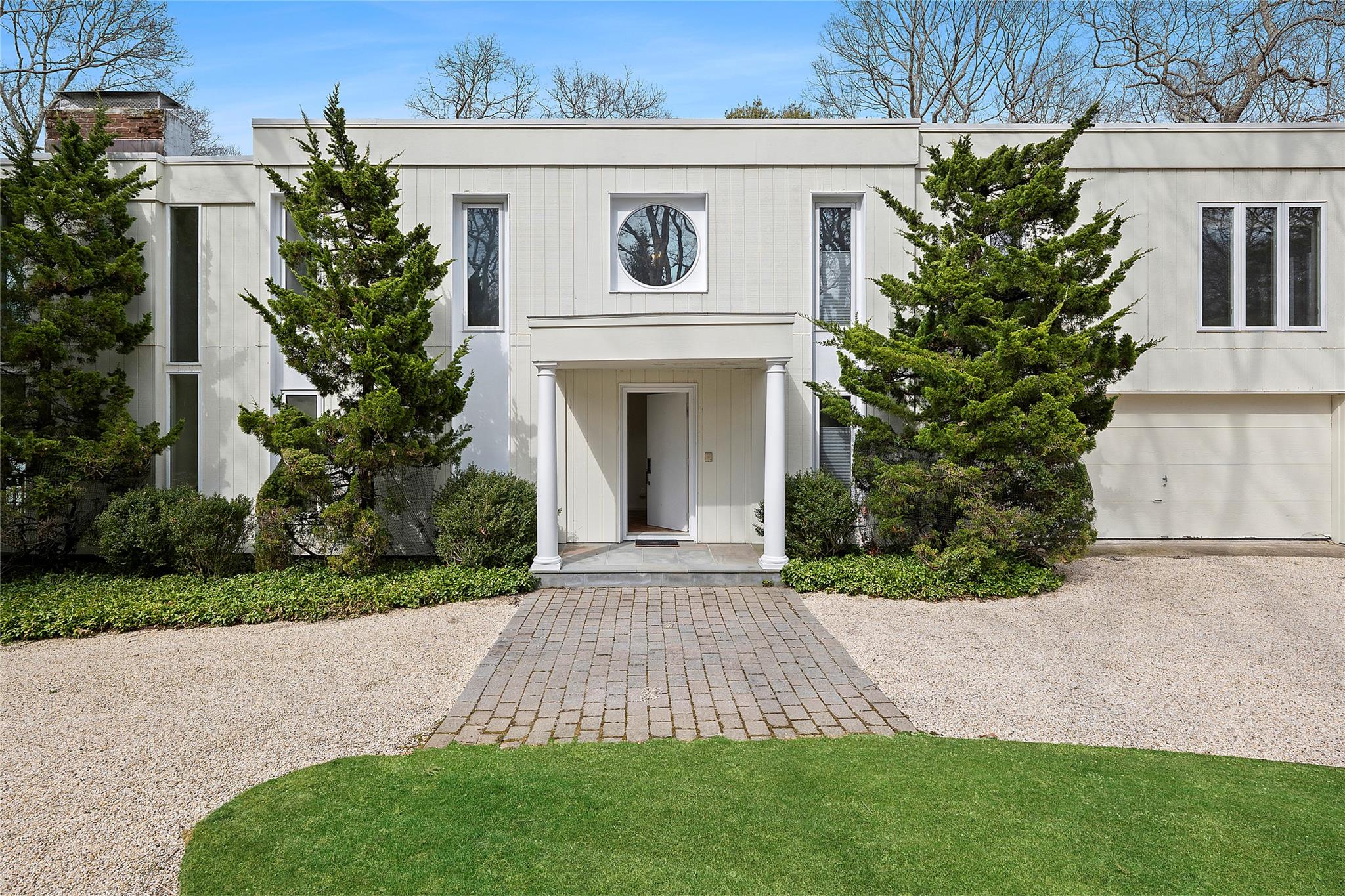 28 Georgica Close Road East Hampton, NY 11937 - Photo 1 of 23 View of front of home featuring an attached garage