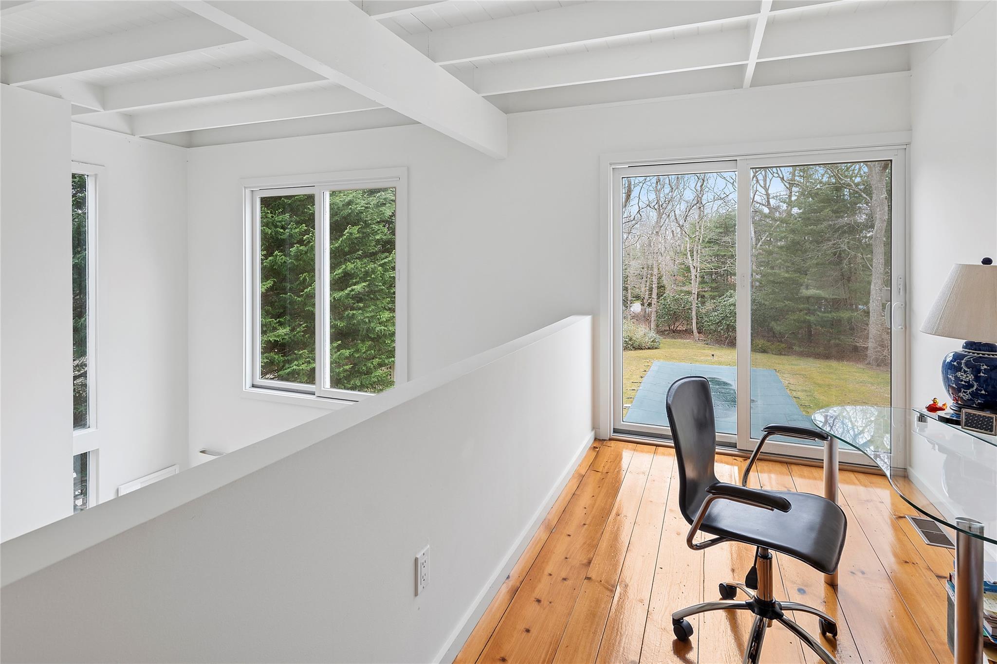 28 Georgica Close Road East Hampton, NY 11937 - Photo 11 of 23 Home office with baseboards, light wood-style floors, and beamed ceiling