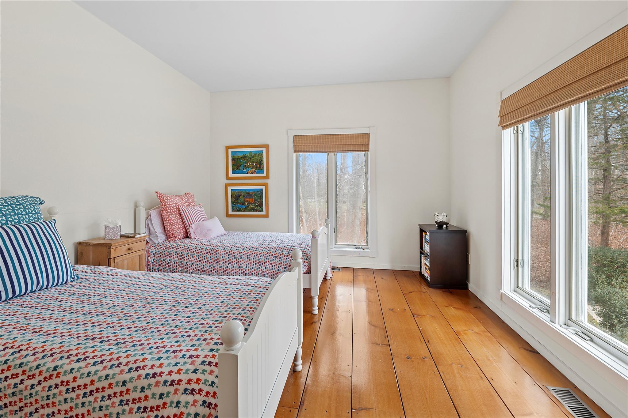 28 Georgica Close Road East Hampton, NY 11937 - Photo 14 of 23 Bedroom featuring light wood finished floors, multiple windows, visible vents, and baseboards
