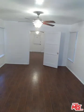 an empty room with wooden floor