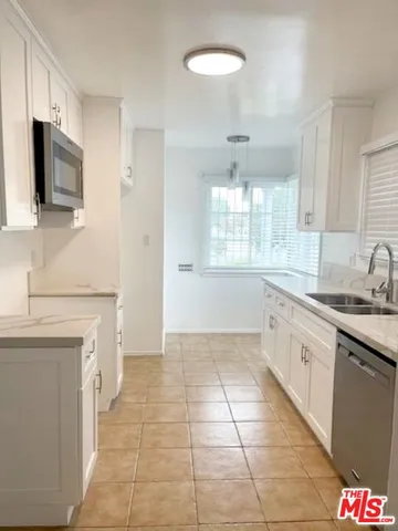 a bathroom with a sink a vanity and mirror