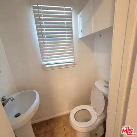 a bathroom with a sink a mirror and a bathtub