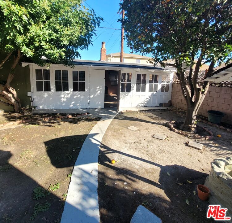 3760 Wellington Road Los Angeles, CA 90016 - Photo 42 of 52 a front view of house with yard outdoor seating and barbeque oven