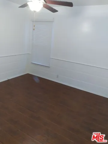 a house with trees in the background